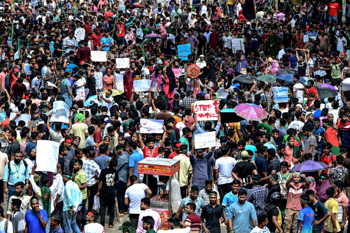 Protesters block the Shahbagh intersection during a protest in Dhaka on August 4, 2024, to demand justice for the victims arrested and killed in the recent nationwide violence during anti-quota protests. The death toll from clashes on August 4 between Bangladeshi protesters demanding Prime Minister Sheikh Hasina resign and pro-government supporters has risen to at least 23, police and doctors said. (Photo by Munir UZ ZAMAN / AFP)