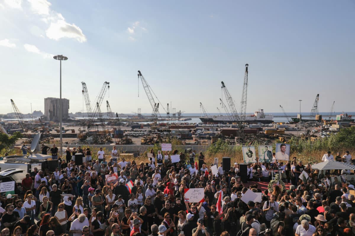 Protesters lift portraits of relatives they lost in the Beirut port blast during a march on the fourth anniversary of the devastating explosion near the capital city's harbour on August 4, 2024. Hundreds gathered near Beirut's port on August 4 to mark four years since a catastrophic blast, one of history's biggest non-nuclear explosions, devastated Lebanon's capital, which killed more than 220 people, injured at least 6,500 and devastated swathes of the capital. (Photo by Ibrahim AMRO / AFP)