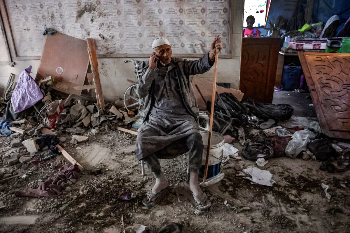 An elderly man sits amid the rubble inside a school used as a temporary shelter for displaced Palestinians in Gaza City, after it was hit by an Israeli strike on August 10, 2024, that killed more than 90 people, as the conflict between Israel and the Hamas movement continues.