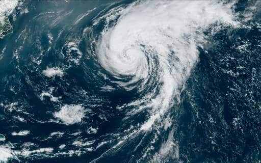 This satellite image obtained from the National Oceanic and Atmospheric Administration shows Hurricane Ernesto at 14:50 Zulu on August 17, 2024. - Ernesto lashed Bermuda with heavy rains and strong winds August 17, leaving much of the British Atlantic Ocean territory without power, with meteorologists warning of a dangerous storm surge and floods. The hurricane, which hit Puerto Rico earlier this week, made landfall at 5:30 am local time (0830 GMT) packing maximum sustained winds of 85 miles (137 kilometers) per hour, according to the US-based National Hurricane Center. (Photo by Handout / NOAA/GOES / AFP) 