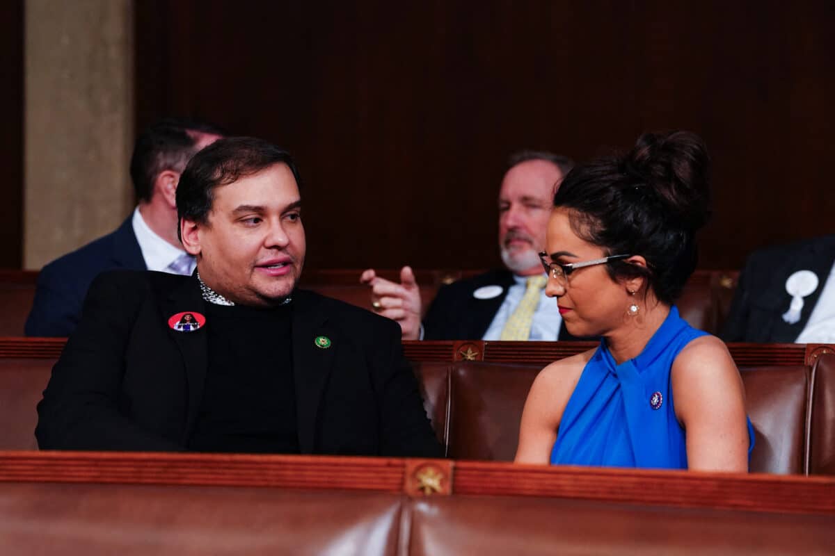 Former Republican Representative from New York George Santos (L) chats with US Representative Lauren Boebert (R-CO) (R) ahead of US President Joe Biden's third State of the Union address to a joint session of Congress in the House Chamber of the US Capitol in Washington, DC, on March 7, 2024. (Photo by SHAWN THEW / POOL / AFP)