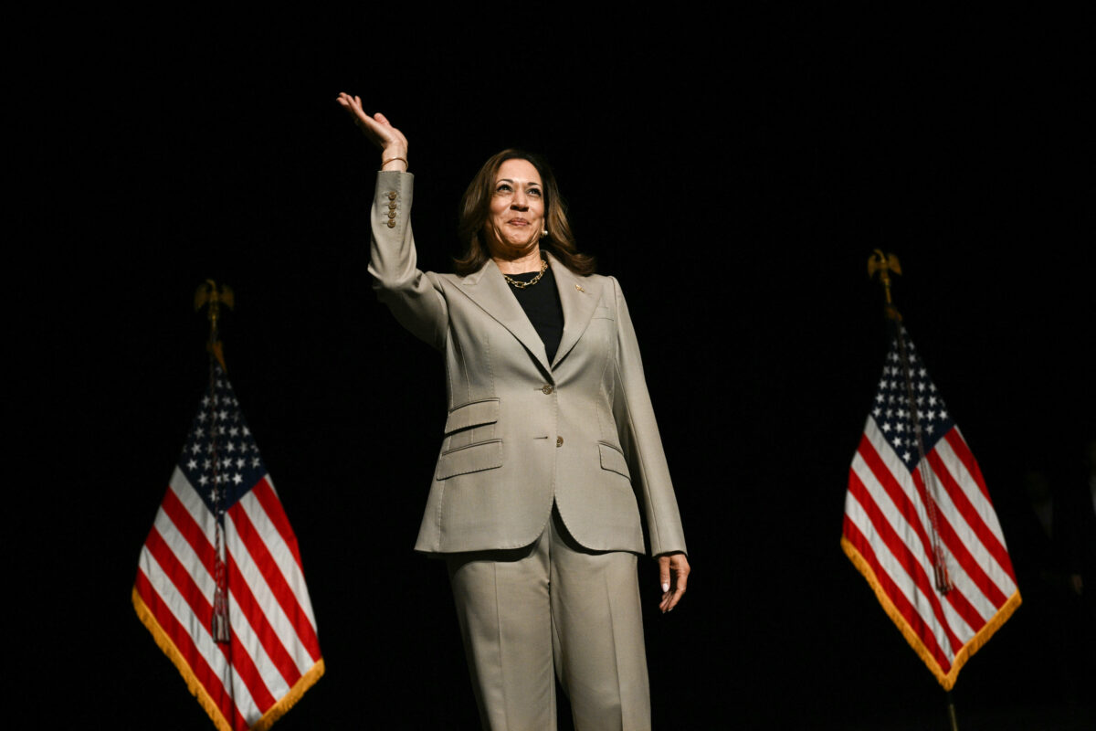 US Vice President and Democratic presidential candidate Kamala Harris waves to the crowd in the overflow room after speaking at Prince George's Community College in Largo, Maryland, on August 15, 2024. (AFP)