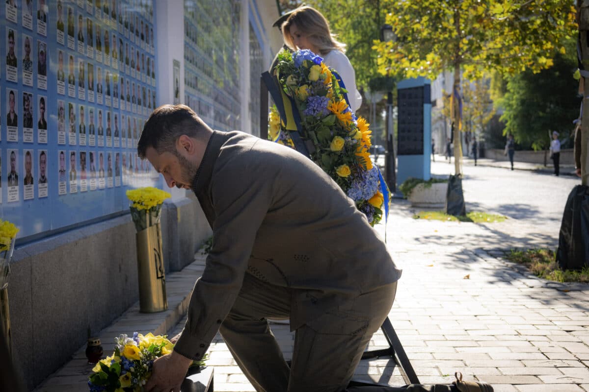 This handout photograph taken and released by the Ukrainian Presidential Press Service on August 24, 2024, shows President Volodymyr Zelensky (L) and his wife Olena laying flowers at the Wall of Remembrance on the occasion of Independence Day of Ukraine in Kyiv, amid Russian invasion in Ukraine. - Zelensky vowed more retribution against Russia on August 24 and signed a law banning the Moscow branch of the Ukrainian Orthodox Church as the country celebrated its third independence day since the Russian invasion. Kyiv celebrates independence from the Soviet Union as the long war with Russia has reached a dramatic moment, with Ukraine mounting the Kursk incursion and Moscow eyeing more east Ukrainian towns.