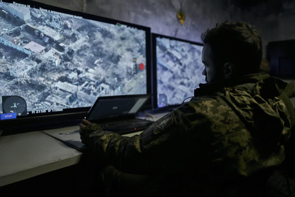 FILE - A Ukrainian soldier watches a drone feed from an underground command center in Bakhmut, Donetsk region, Ukraine, Sunday, Dec. 25, 2022. 