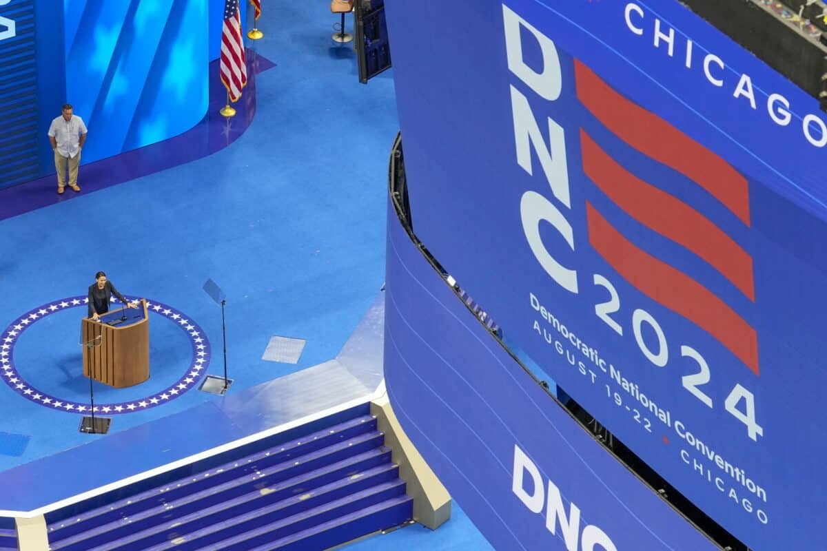 Rep. Alexandria Ocasio-Cortez, D-NY, stands at the podium at the Democratic National Convention at the United Center.