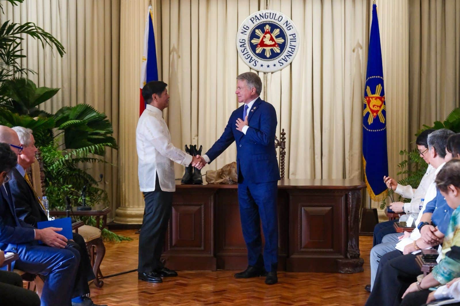 President Ferdinand Marcos Jr. on Thursday gifted commemorative coins to two visiting US congressmen, one of whom gave him cowboy boots.