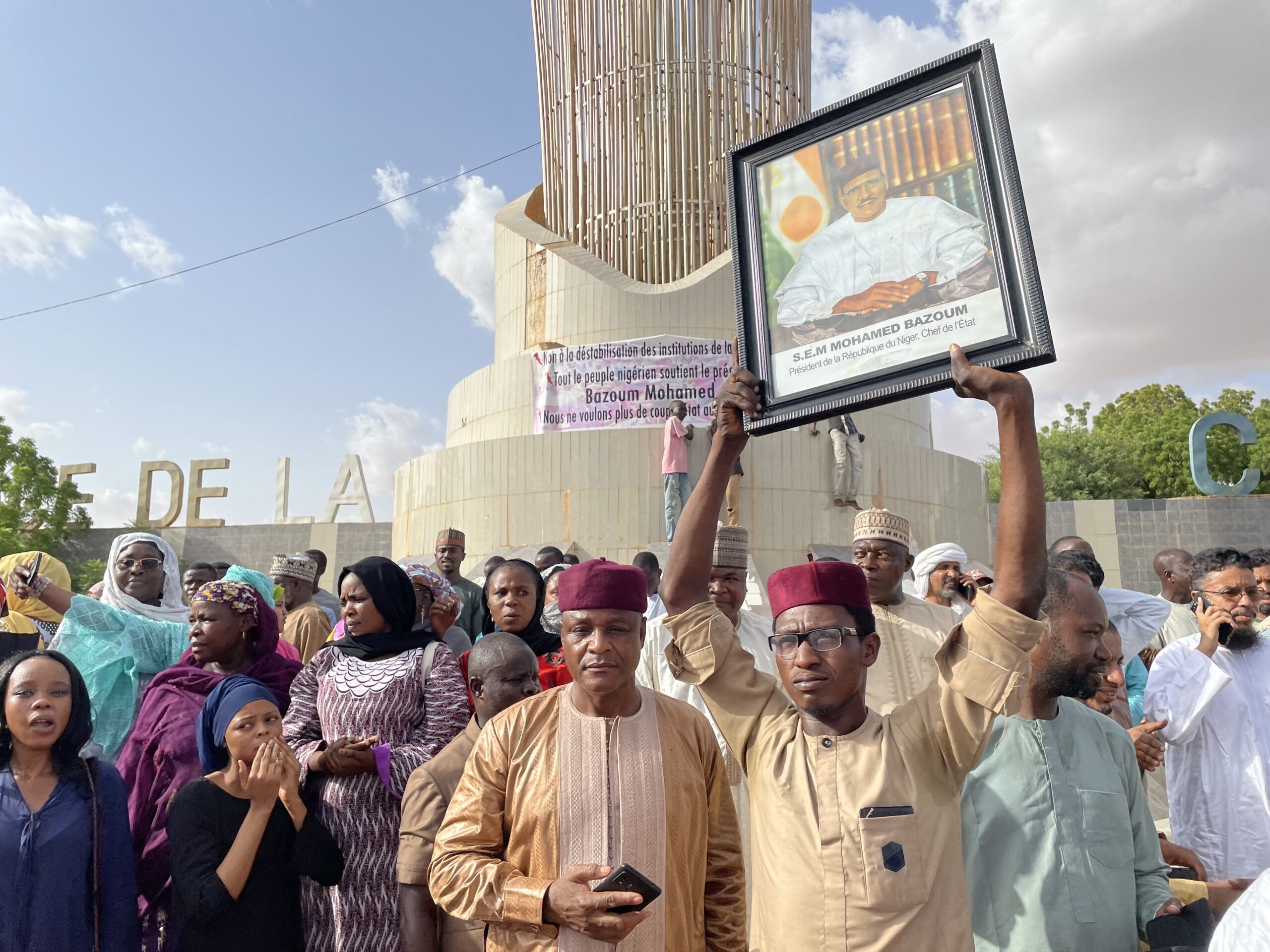 Supporters of Nigerien President Mohamed Bazoum gather to show their support for him in Niamey on July 26, 2023. An attempted coup was underway on July 26, 2023 in the fragile state of Niger, where members of the Presidential Guard detained President Mohamed Bazoum, triggering a standoff with the army, sources said.The West African bloc ECOWAS and the African Union lashed what they called an "attempted coup d'etat," a term echoed by a source close to Bazoum. (Photo by AFP)