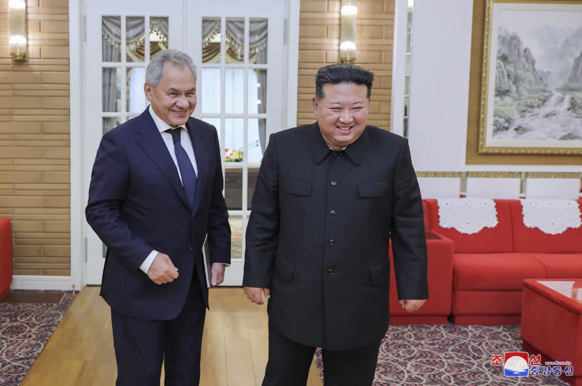 This photo taken on September 13, 2024 and released from North Korea's official Korean Central News Agency (KCNA) via KNS on September 14, 2024 shows North Korea's leader Kim Jong Un (R) meeting with Russia's Security Council Secretary Sergei Shoigu at an undisclosed location in North Korea. 