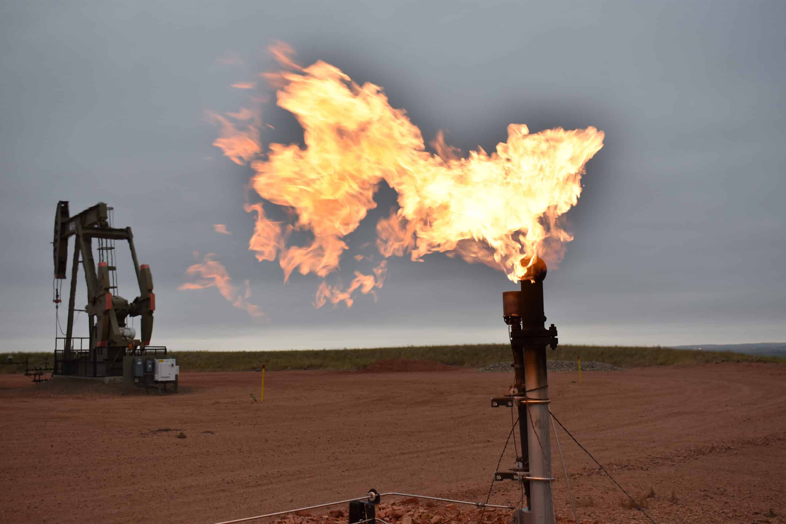 A flare burns natural gas at an oil well in Watford City, N.D., on Aug. 26, 2021. (AP Photo/Matthew Brown, File)