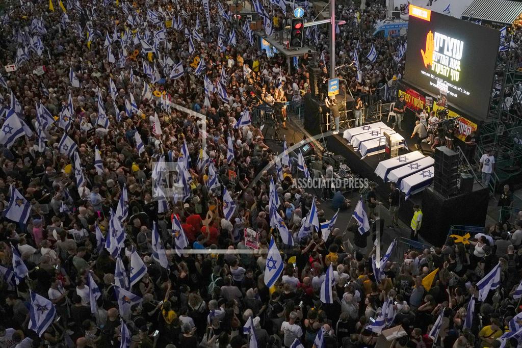 People take part in a protest calling for a deal for immediate release of hostages held in the Gaza Strip by the Hamas militant group, in Tel Aviv, Sunday, Sept. 1, 2024. (AP Photo/Ariel Schalit)