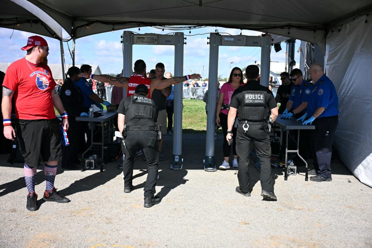 Attendees go through security ahead of former US President and Republican presidential candidate Donald Trump's campaign rally at the site of his first assassination attempt in Butler, Pennsylvania, on October 5, 2024, 