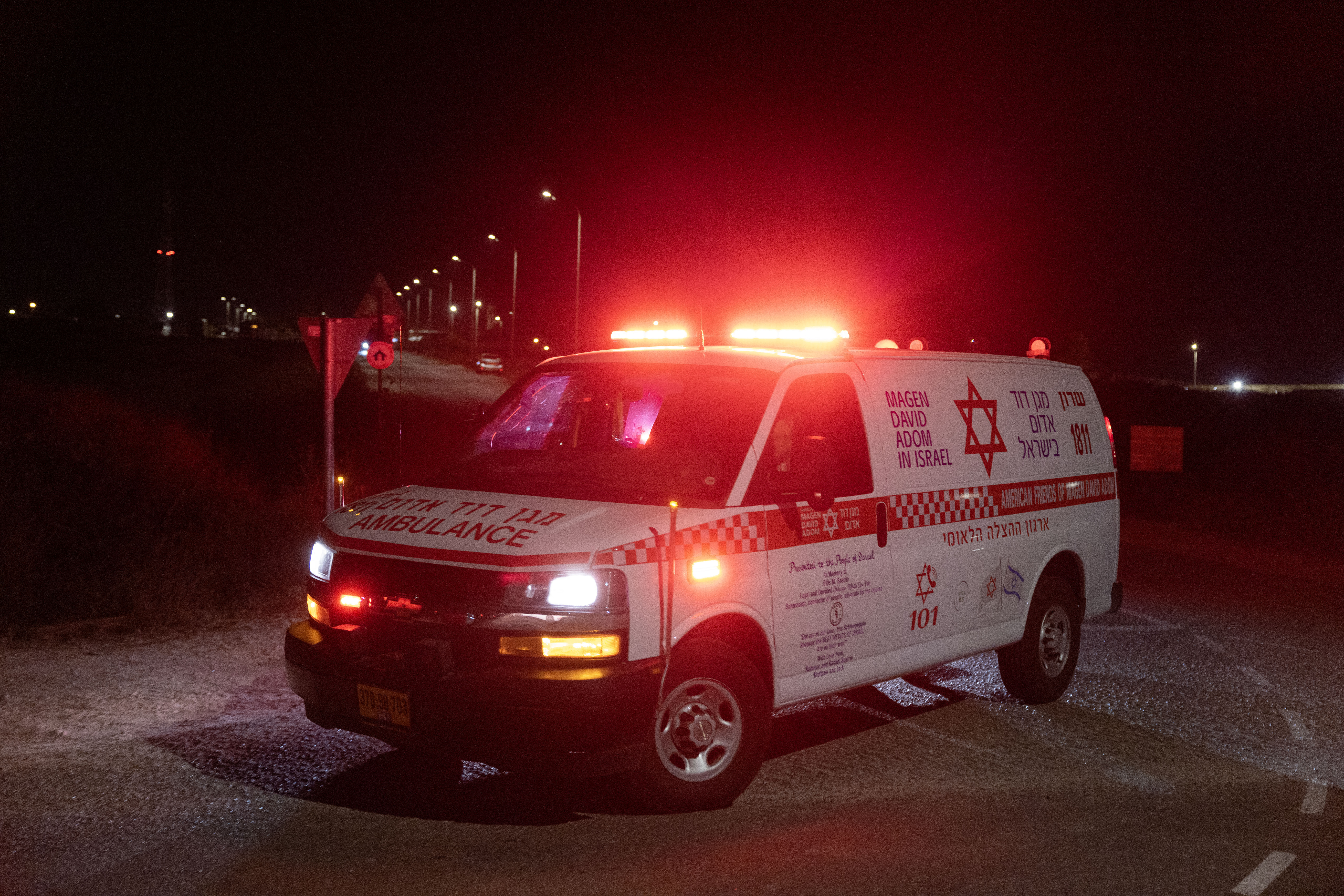 An ambulance leaves the scene of a drone strike near the northern Israeli town of Binyamina, on October 13, 2024, amid the continuing war between Israel and Hezbollah. - An Israeli volunteer rescue service on October 13 said more than 60 people were wounded south of Haifa, where Hezbollah earlier said it targeted a military base with drone strikes. (Photo by Oren ZIV / AFP)