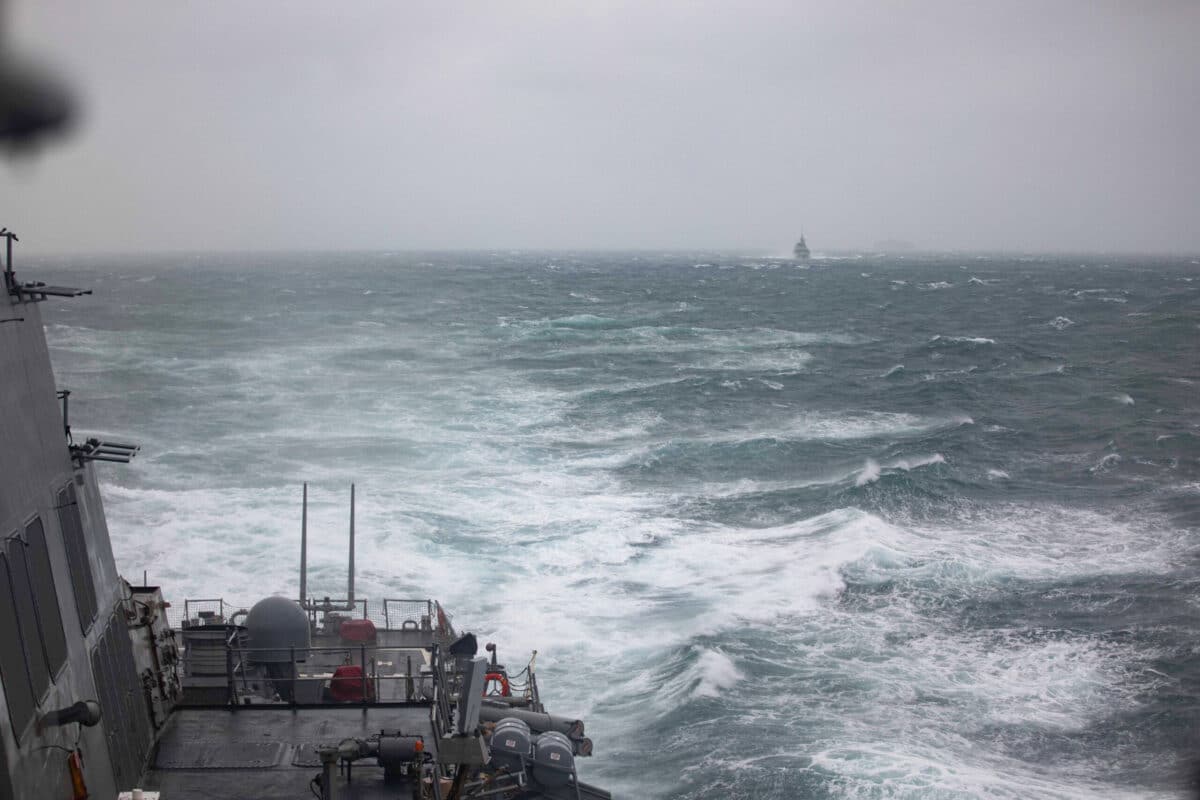 This handout photo taken on October 20, 2024 and released on October 21 by the US Navy shows the Arleigh Burke-class guided-missile destroyer USS Higgins (DDG-76), foreground, and Royal Canadian Navy Halifax-class frigate HMCS Vancouver (FFH 331), in background, sailing in the Taiwan Strait. - A US and a Canadian warship have passed through waters separating Taiwan and China, a week after Beijing held large-scale military drills in the sensitive passage. (Photo by Trevor Hale / US NAVY / AFP)