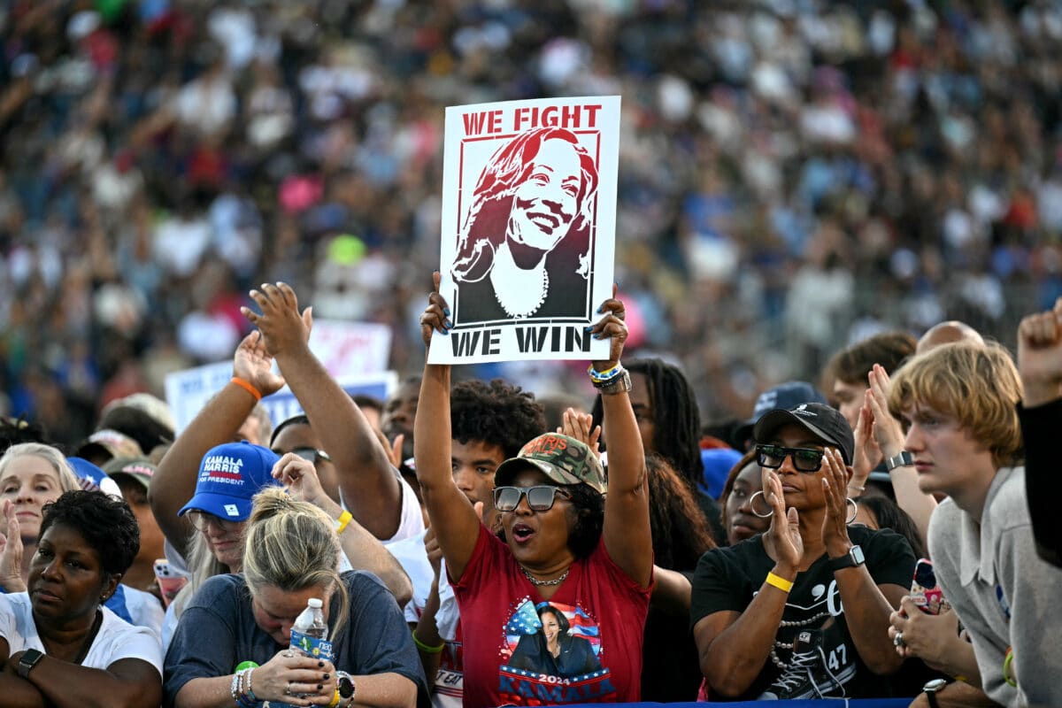 Supporters cheer during a campaign rally with former US President Barack Obama supporting US Vice President and Democratic presidential candidate Kamala Harris at the James R Hallford Stadium in Clarkston, Georgia on October 24, 2024. 