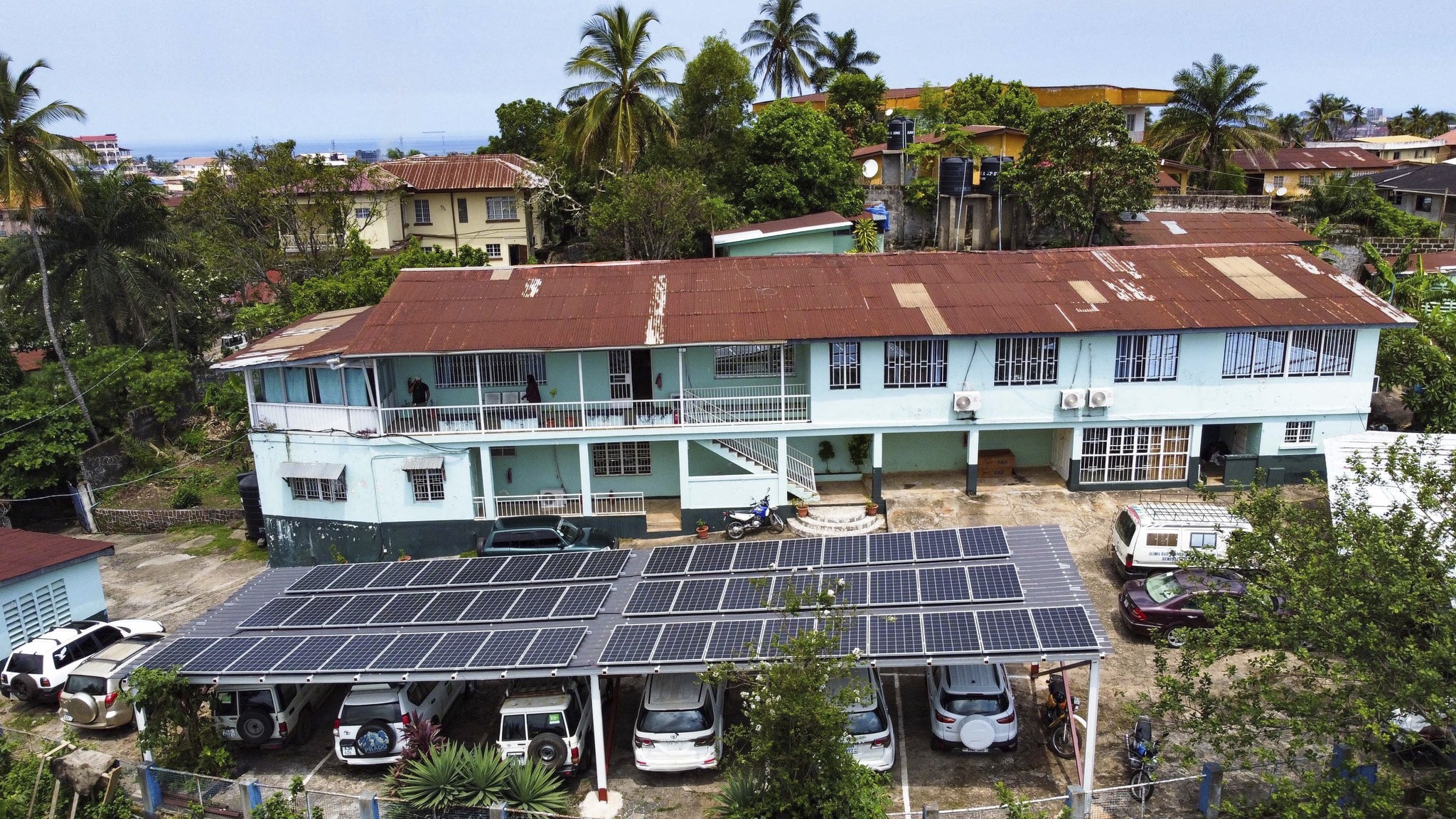 This photo released by Easy Solar shows a large solar panels installation on a rooftop of an office building in Freetown, Sierra Leone, Tuesday Aug. 13, 2024. (Muctarr Bah Mohamed/Easy Solar via AP)