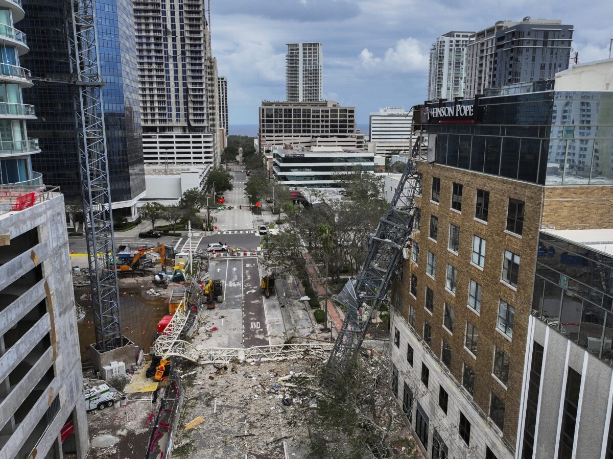 An aerial drone view of the scene where a downtown high-rise was smashed by a fallen crane from Hurricane Milton at 490 1st Avenue South, Friday, Oct. 11, 2024 in St. Petersburg, Fla. The building damaged by Hurricane Milton is home to the Tampa Bay Times, a law firm, a defense contractor and more.