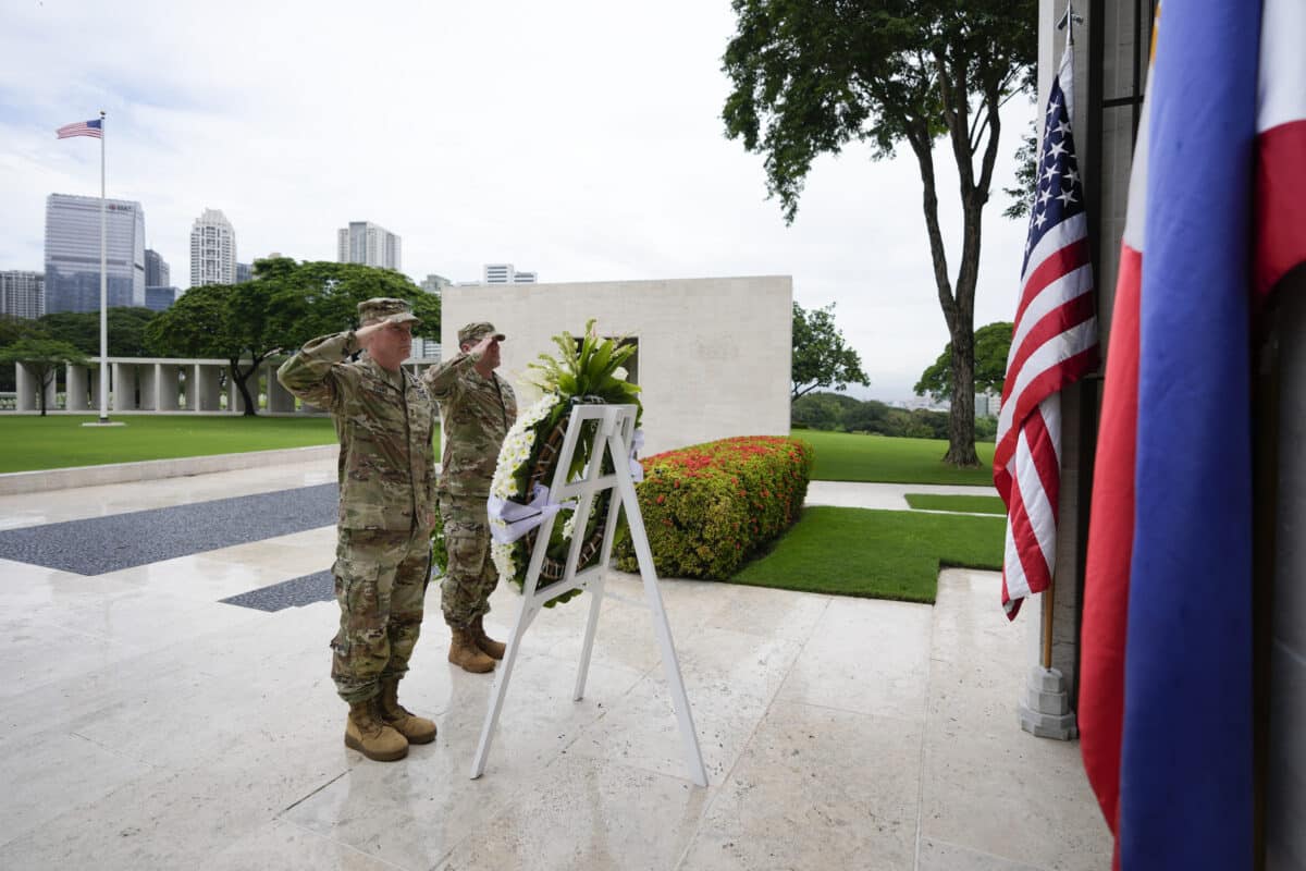 U.S. Maj. Gen. Marcus Evans, left, commanding general of the U.S. Army's 25th Infantry Division and Sgt. Major Shaun Curry salute during a wreath laying rite to honor American soldiers died during World War II at the Manila American Cemetery and Memorial in Taguig, Philippines Monday, Oct. 21, 2024.