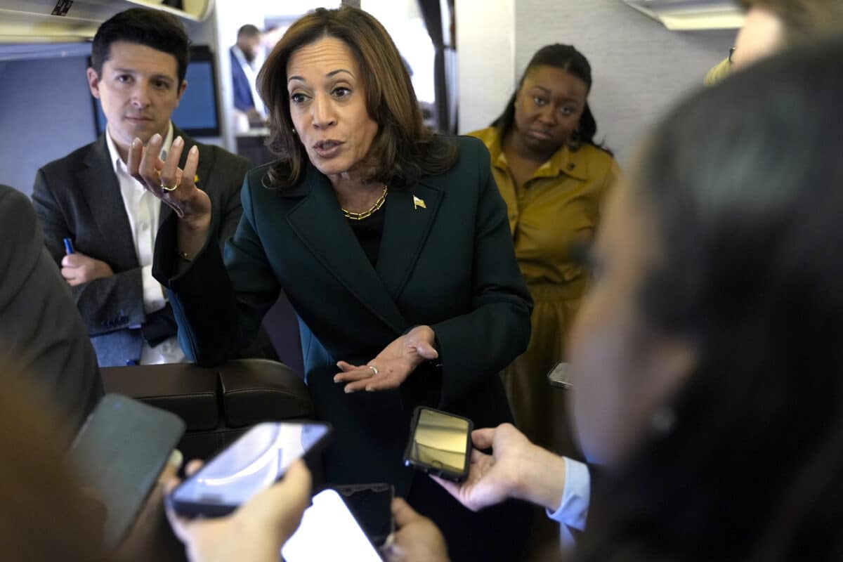 Democratic presidential nominee Vice President Kamala Harris speaks with members of the press on board Air Force Two at Philadelphia International Airport, Monday, Oct. 21, 2024, in Philadelphia, before departing to Michigan.