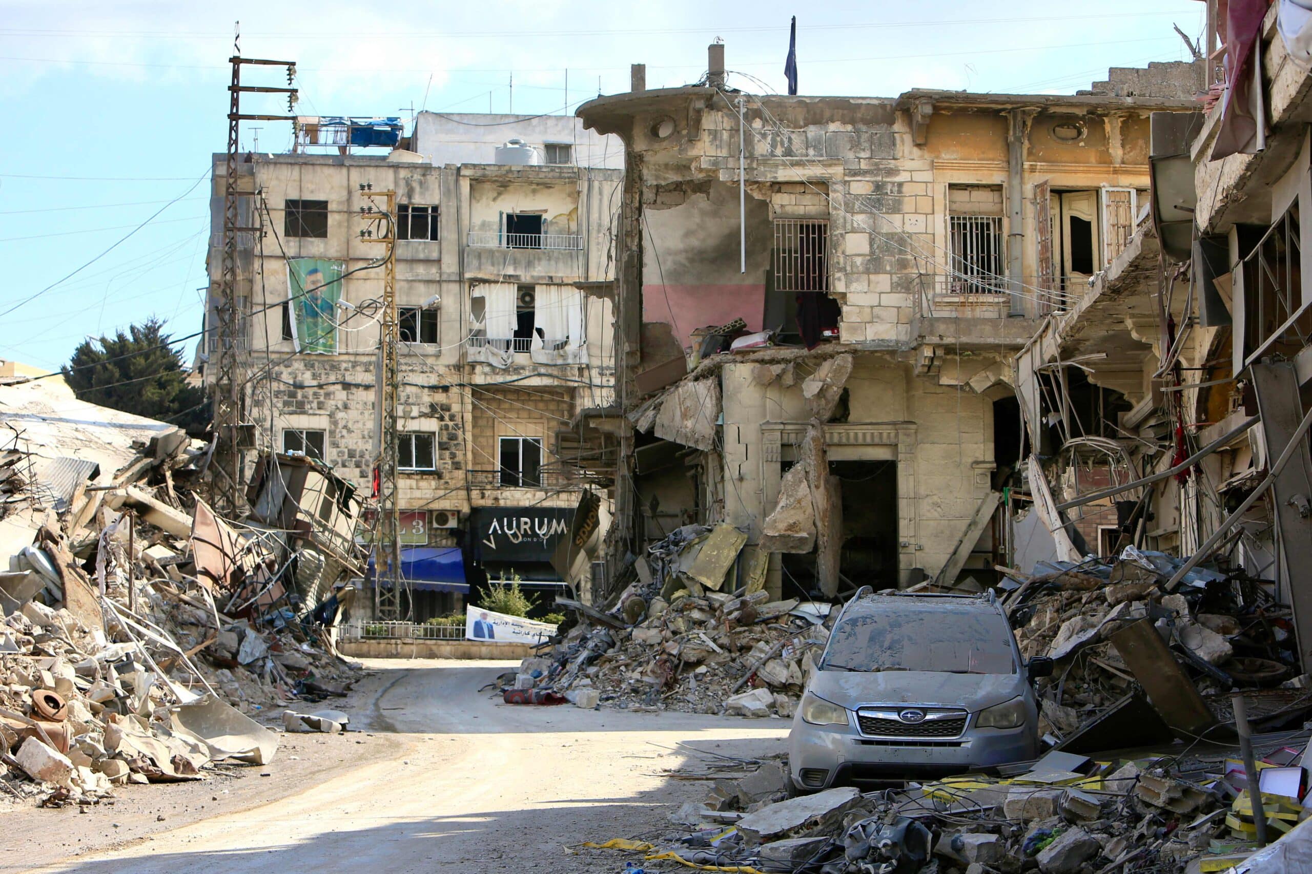 DEATH FROMTHE SKY Scores of migrant workers, includingfrom the Philippines, appeal to their governments to help them leave Lebanon, amid escalating violence, such as on this street in Nabatieh City, where Israeli air strikes killed 16 people on Thursday.