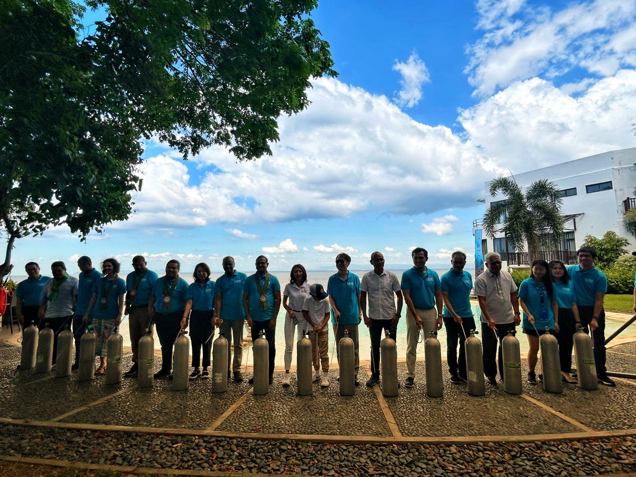 Tourism Secretary Christina Garcia Frasco, along with ambassadors and representatives from other countries, during the ceremonial banging of oxygen tanks in Anilao, Batangas, on November 28, 2024. It symbolizes the commitment of the Philippines to preserve its marine biodiversity. (Photo courtesy of Luisa Cabato/INQUIRER.net)