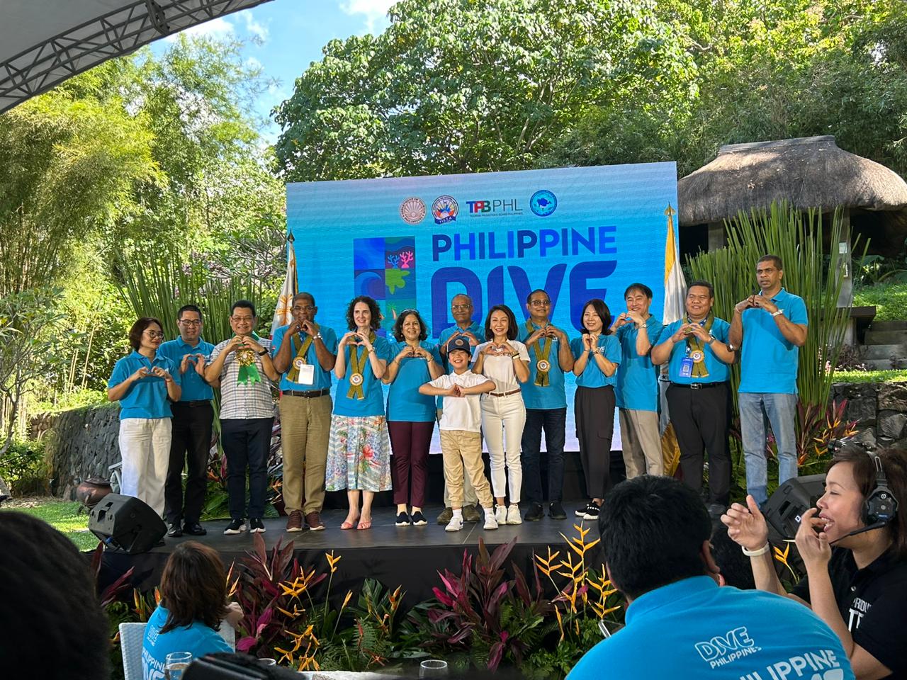 Tourism Secretary Christina Garcia Frasco and ambassadors and representatives from other countries pose for a group photo during the launching of the first-ever Philippine Dive Experience in Anilao, Batangas, on November 28, 2024. (Photo courtesy of Luisa Cabato/INQUIRER.net)