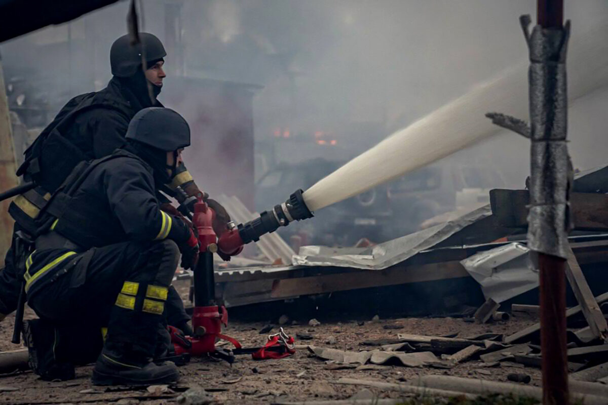 In this handout photograph taken and released by the Ukrainian Emergency Service on November 26, 2024, Ukrainian rescuers work to extinguish a fire in a residential area following a missile attack in Sumy. (Photo by Handout / UKRAINIAN EMERGENCY SERVICE / AFP) 