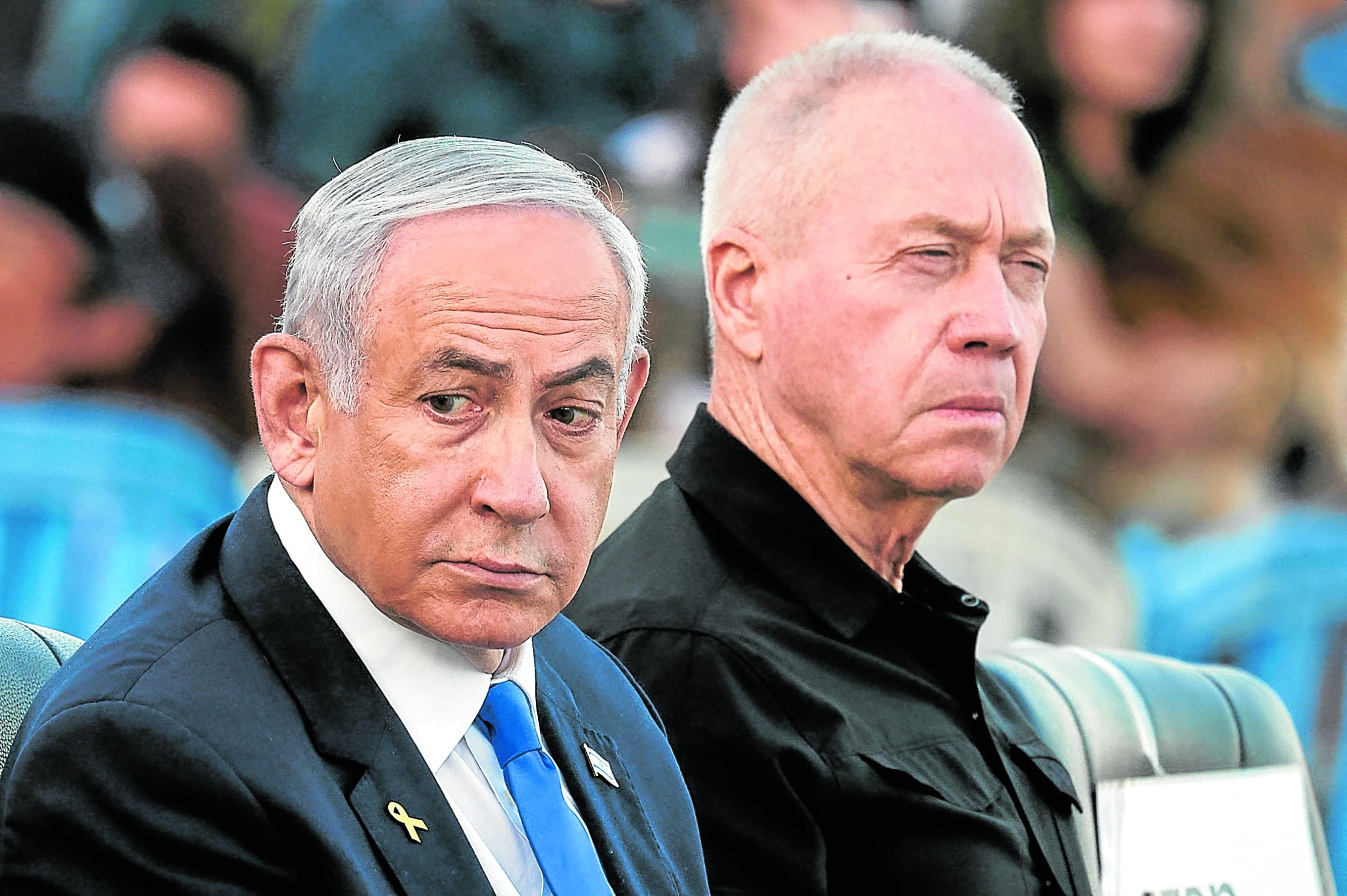 WANTED IN THE HAGUE Israeli Prime Minister BenjaminNetanyahu and Defense Minister Yoav Gallant attend a military ceremony in October before the defense chief was fired early this month over his differences with Netanyahu in the handling of the conflict in Gaza and Lebanon. 