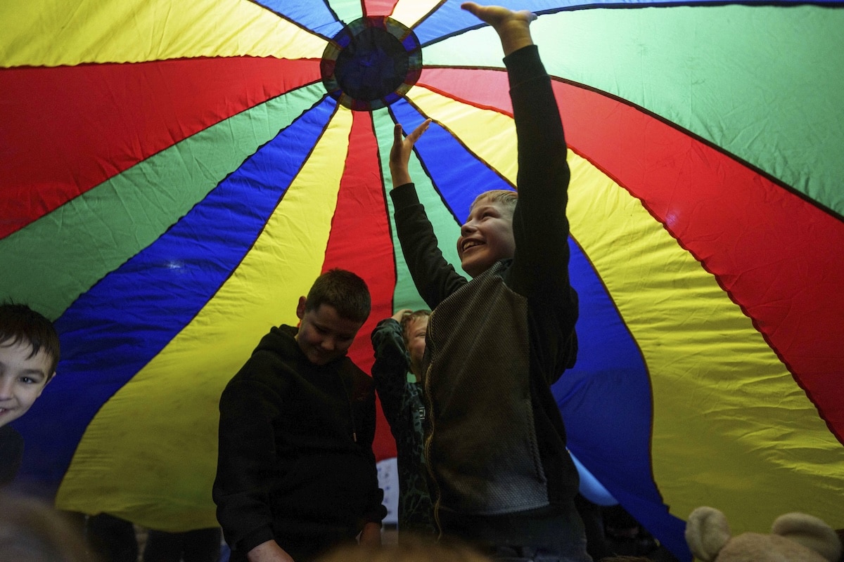 PHOTO: Ukrainian children under a play parachute