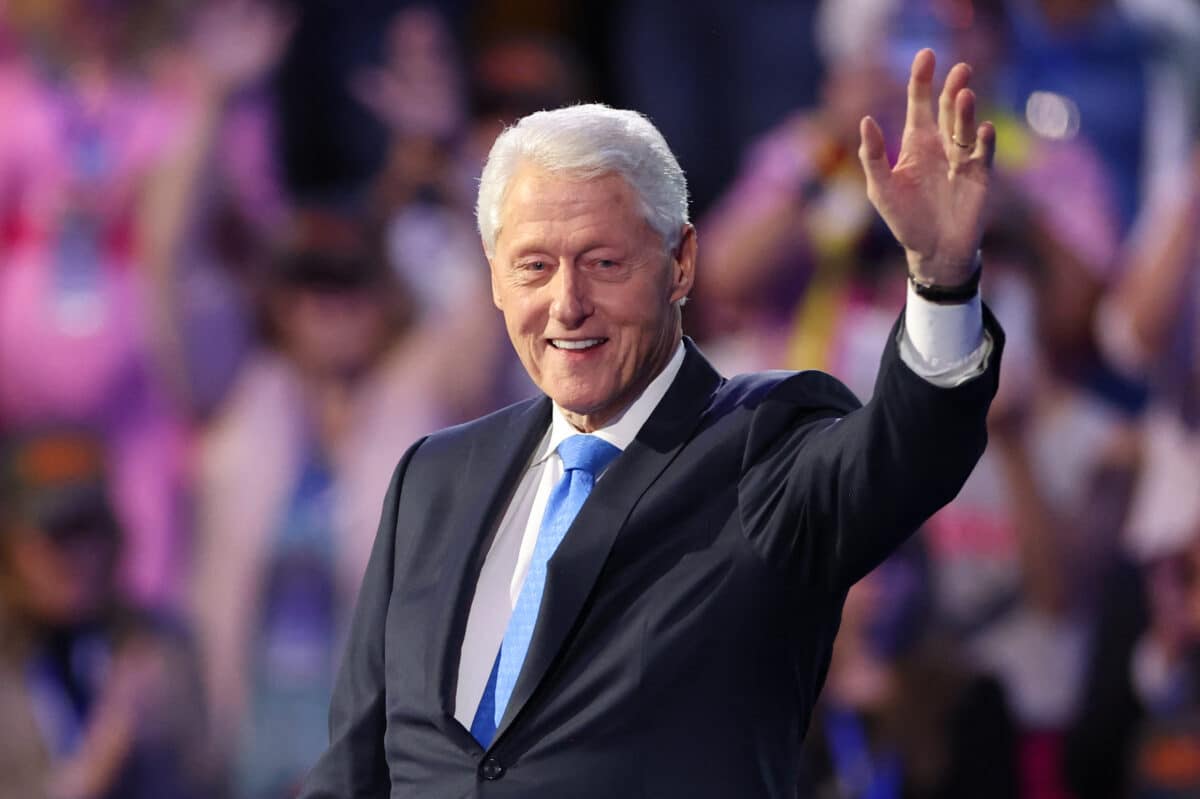 (FILES) Former US President Bill Clinton arrives to speak on the third day of the Democratic National Convention (DNC) at the United Center in Chicago, Illinois, on August 21, 2024. - Bill Clinton, the former US president who has faced a series of health issues over the years, was admitted to a hospital in Washington after developing a fever, his office said on December 23, 2024. (Photo by CHARLY TRIBALLEAU / AFP)