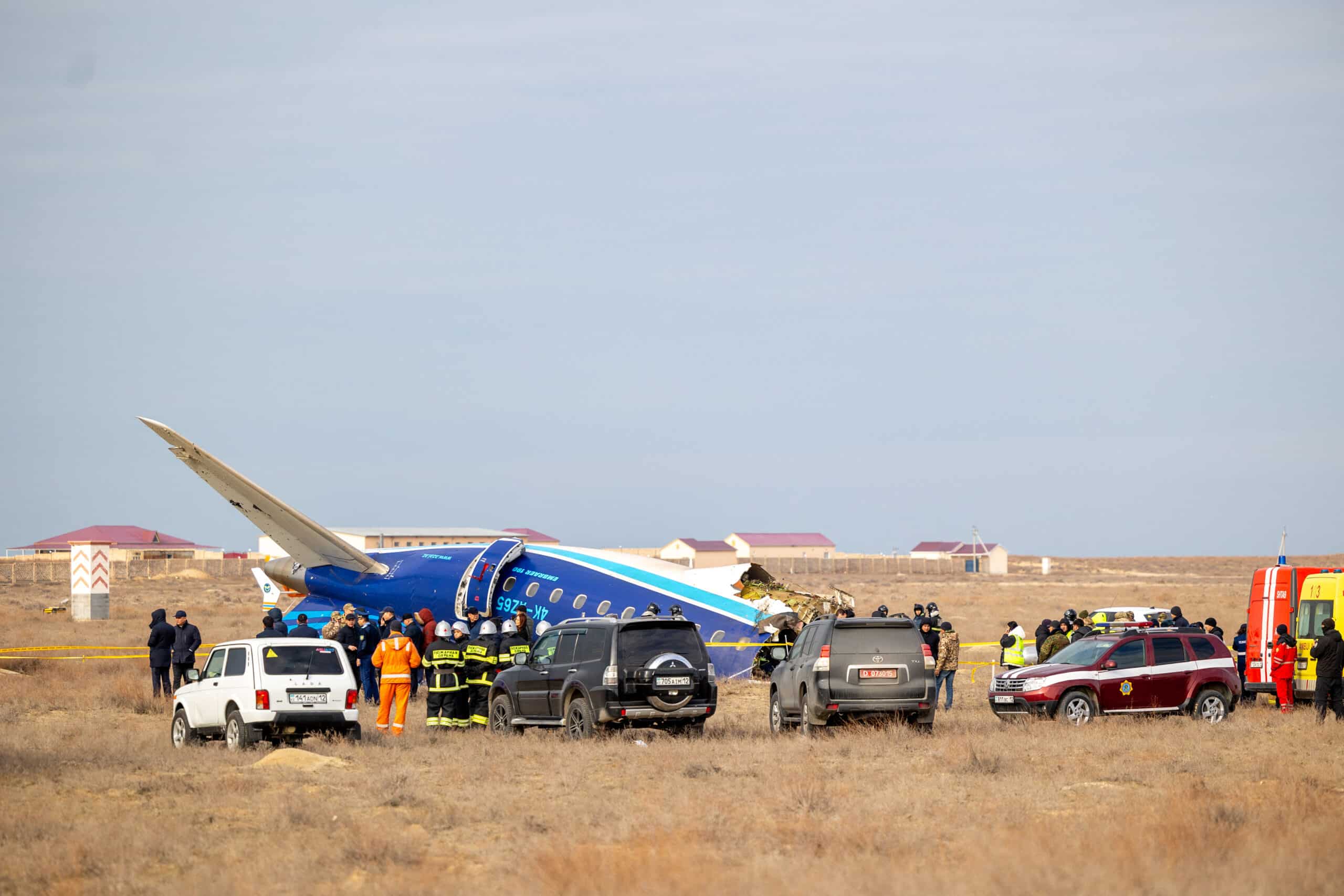 Emergency specialists work at the crash site of an Azerbaijan Airlines passenger jet near the western Kazakh city of Aktau on December 25, 2024. (Photo by Kamilla Jumayeva / AFP) 