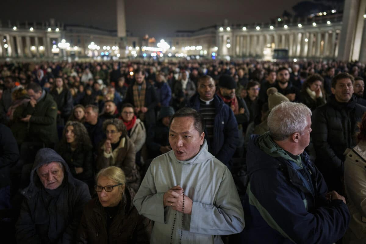 Faithful pray during a nightly rosary in St. Peter's Square at The Vatican for Pope Francis' recovery, Monday, Feb. 24, 2025.