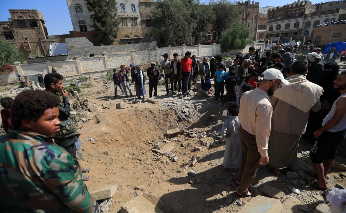 People assess the damage caused by a reported strike in Yemen's Huthi-held capital Sanaa on April 20, 2025. At least two people were killed and 11 others injured in air strikes, blamed on the United States, overnight on April 20 in and around Yemen's capital Sanaa, media controlled by the country's Huthi rebels said. — Photo by Agence France-Presse