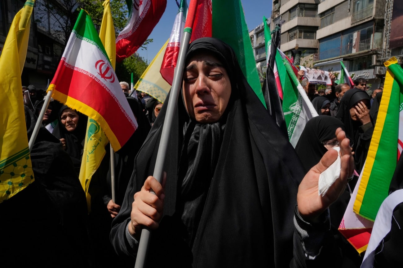 A government supporter weeps during a mourning ceremony marking the 40th day since the death of Iranian Supreme Leader Ayatollah Ali Khamenei, who was killed in the U.S. and Israel strikes in Tehran, Iran, Thursday, April 9, 2026. (AP Photo/Vahid Salemi)