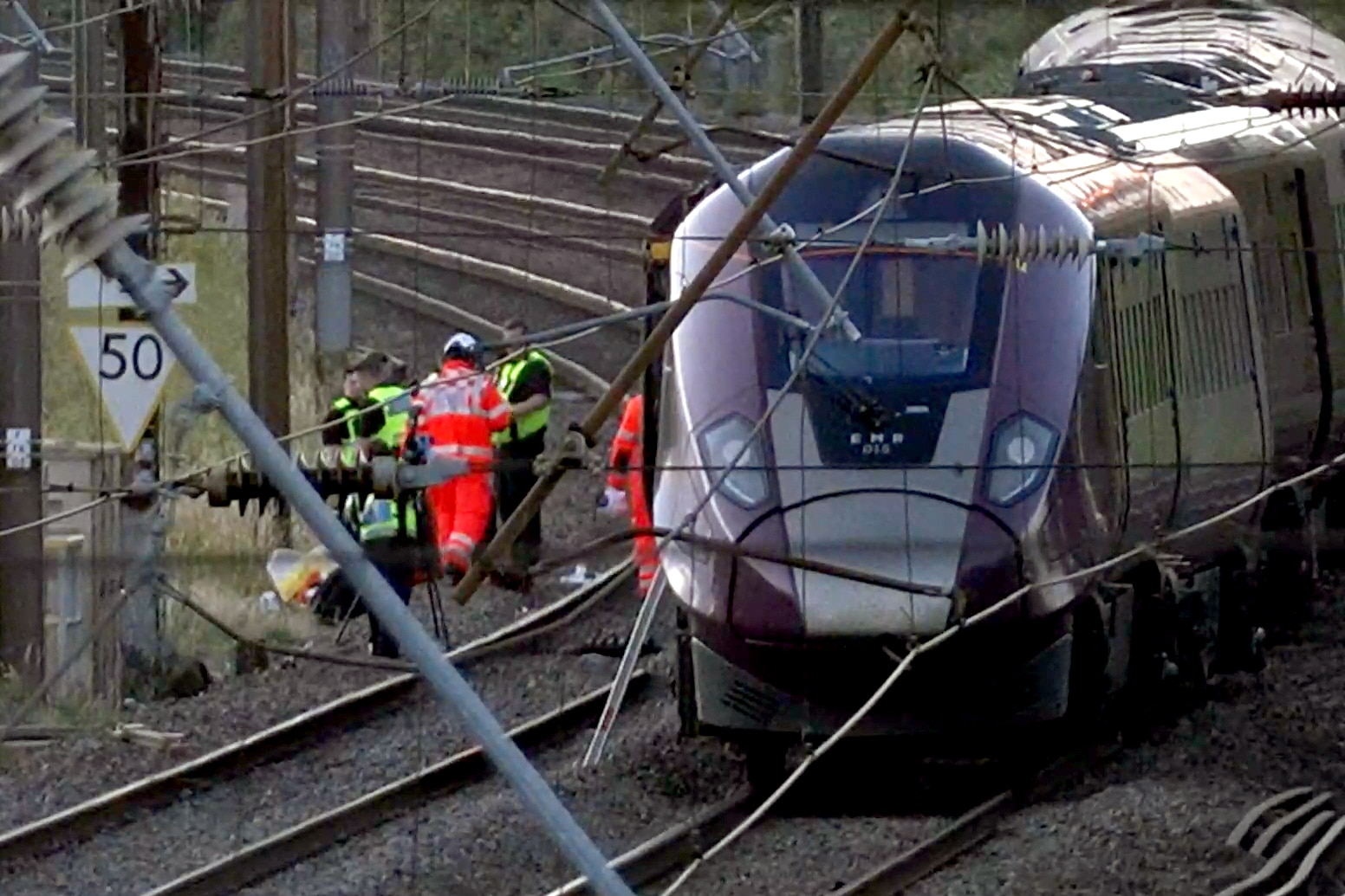 Trains collide north of London, killing 1 person, injuring dozens