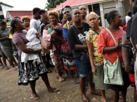 Solomon Islanders queue up to vote outside a polling station in Honiara on April 17, 2024.